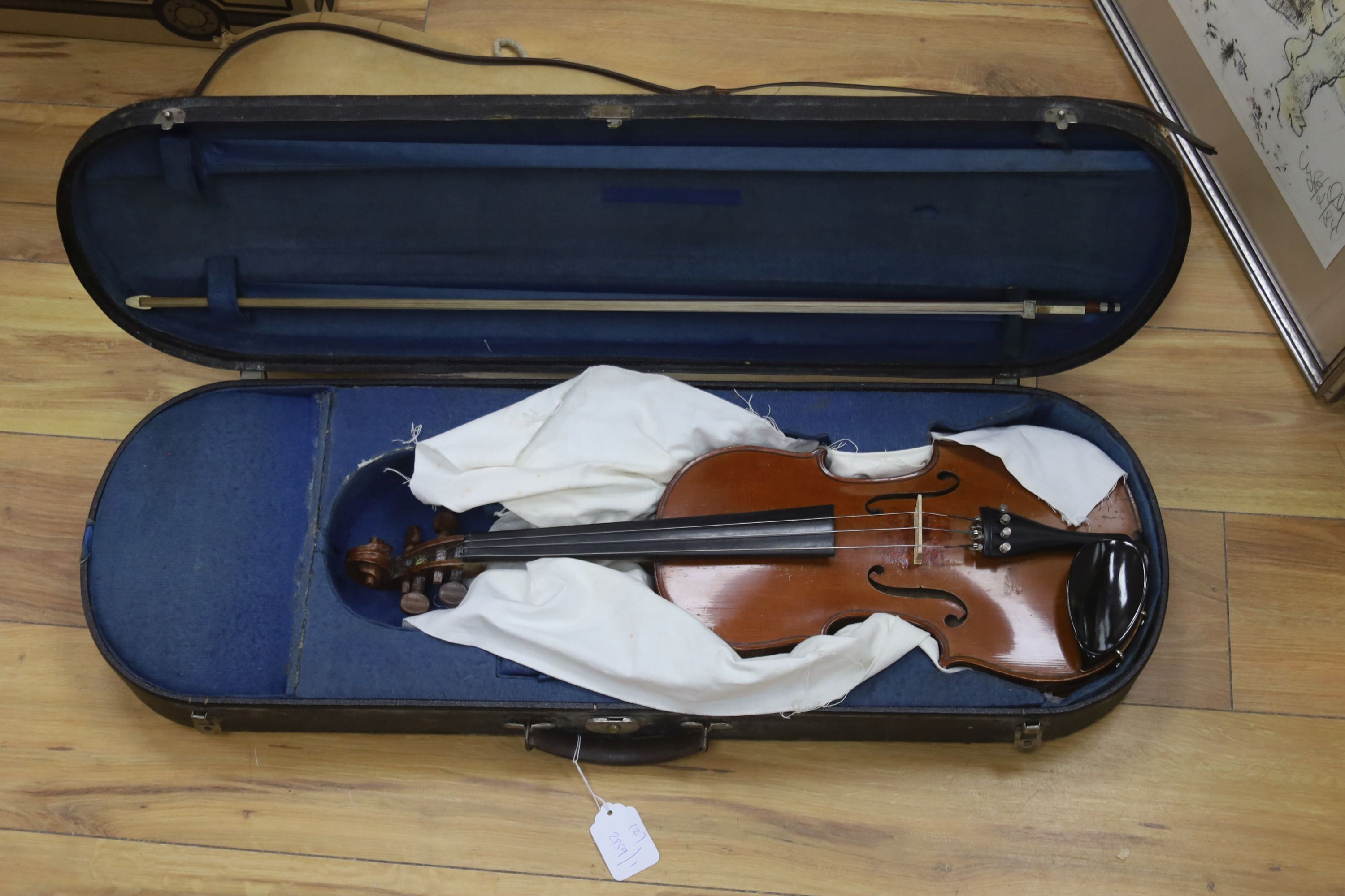 An early 20th century French vioilin, cased with bow and a cased saxon violin